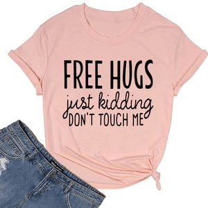 Detail of pink cotton T-shirt featuring 'Free Hugs' print and side knot design