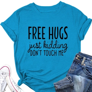 Sky blue t-shirt detail showing Free Hugs Just Kidding slogan and soft fabric texture