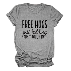 Close-up of grey cotton T-shirt featuring Free Hugs Just Kidding humor slogan print