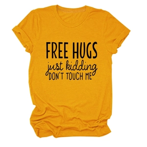 Detail of Free Hugs slogan print and rolled sleeve hem on mustard yellow cotton t-shirt