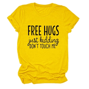 Detail of Free Hugs slogan print on yellow cotton t-shirt with classic crew neck