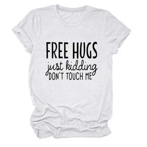 Detail of Free Hugs slogan print on white cotton crew neck t-shirt with rolled sleeves