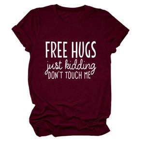 Detail of Free Hugs slogan print and rolled sleeve hem on burgundy cotton T-shirt