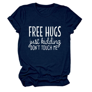 Detailed close-up of dark blue cotton t-shirt featuring Free Hugs Just Kidding text print