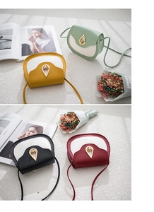 Detail of four color-block saddle bags with gold teardrop locks and thin straps