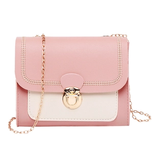 Chic pink and beige crossbody bag with gold chain strap and circular rotary lock