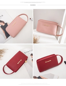 Detail view of pink and red lychee grain leather clutch bags with gold metal logo