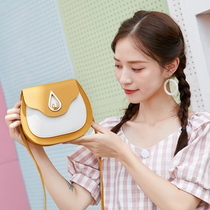 Chic yellow and white contrast saddle bag with teardrop metal lock and thin strap