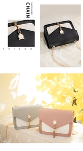 Detail of color-block mini shoulder bags with pearl tassel and cat-ear gemstone charms