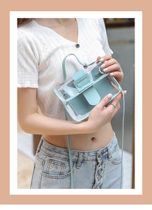 Close-up of mini transparent PVC crossbody bag with leather flap worn by a model