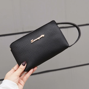 Fashionable black pebbled leather wristlet clutch bag with gold logo for daily use