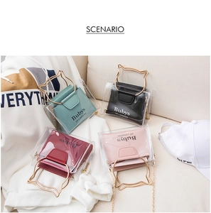 Close-up of cat-ear handle transparent bucket bags with metallic chain straps in four colors
