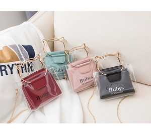 Detail of transparent PVC cat-ear bucket bags with chain straps in multiple colors
