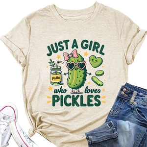 Flat lay of oatmeal crewneck T-shirt with 'Just a girl who loves pickles' cartoon print