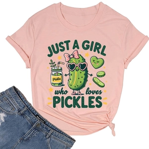 Flat lay of a pink cotton T-shirt featuring a cute pickle cartoon and heart graphics