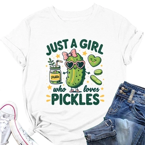 Detail of white cotton T-shirt featuring a cute cartoon pickle print and artistic lettering