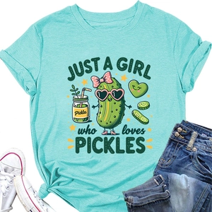 Flat lay of a mint green cotton T-shirt featuring a cute cartoon pickle graphic print