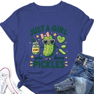 Flat lay of navy blue T-shirt with Just a Girl Who Loves Pickles print and sneakers