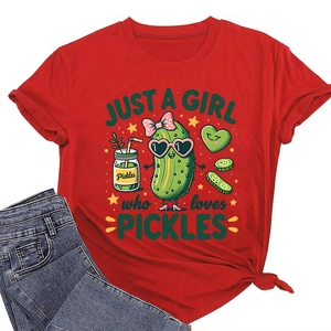 Detail of red crew neck t-shirt featuring a cartoon pickle print and denim jeans