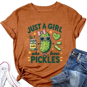 Flat lay of brown cotton T-shirt featuring cartoon pickles print and denim shorts