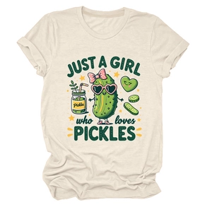 Detailed view of the cute pickle cartoon print on a cream-colored crew neck t-shirt