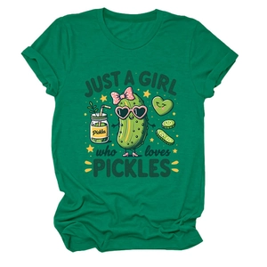 Close-up of green cotton t-shirt featuring a cartoon pickle with a pink bow and heart glasses