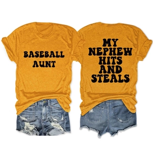 Flat lay of yellow Baseball Aunt t-shirt showing front and back with denim shorts