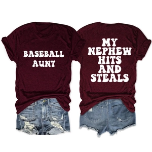 Burgundy crewneck tee featuring My Nephew Hits and Steals white vintage typography
