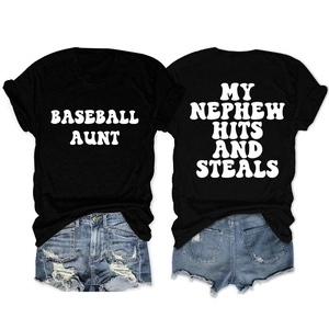 Detail of black Baseball Aunt T-shirt paired with distressed denim shorts on white background