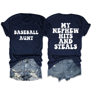 Flat lay detail of navy crewneck T-shirts with white baseball themed printed lettering