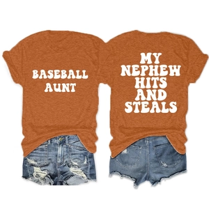 Flat lay of an orange cotton blend T-shirt and distressed denim shorts outfit set