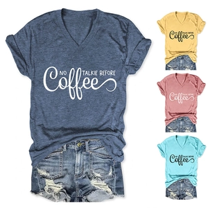 Detail of V-neck cotton T-shirt featuring NO TALKIE BEFORE COFFEE print and distressed denim