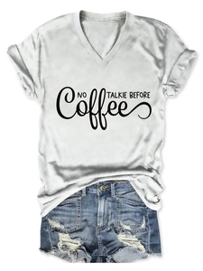 Detail of V-neck white cotton T-shirt featuring NO TALKIE BEFORE COFFEE printed slogan