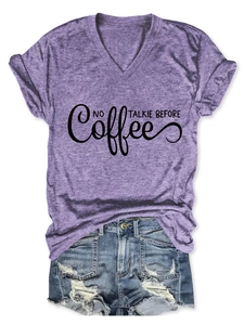 Detail of purple V-neck T-shirt with No Talkie Before text and grey marl texture