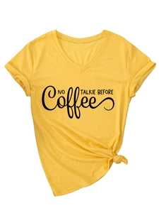 Detail of yellow V-neck t-shirt featuring No Talkie Before Coffee text and side knot