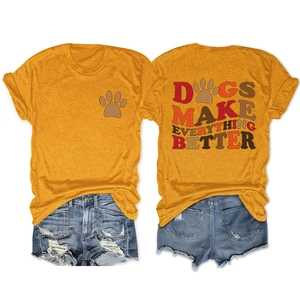 Detail view of front and back dog prints on orange cotton t-shirt with denim shorts