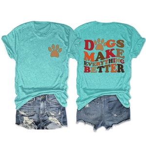 Flat lay of mint green dog-themed T-shirt and ripped denim shorts with back print