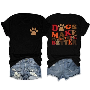 Flat lay of black T-shirt with dog paw print and Dogs Make Everything Better back text
