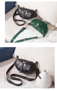 Detail of crocodile pattern crossbody bags with adjustable nylon straps and gold hardware