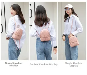 Three-way view of a pink mini backpack with LUCKY lettering and adjustable straps
