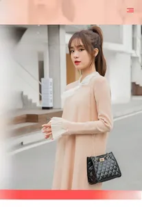 Street style shot of a woman wearing a black quilted bucket bag with golden chain strap