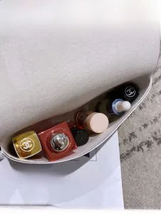 Internal view of a chic white waist bag showing daily cosmetics and high storage capacity