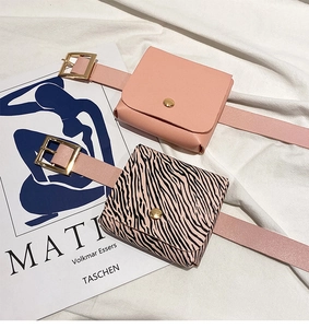 Close-up of pink PU leather belt bags with zebra print flap and gold metal snap buttons