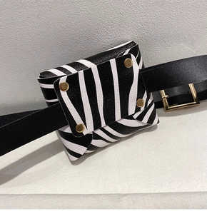 Detail of zebra print waist bag with gold studs and removable black leather belt