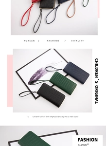 Detail of crocodile pattern faux leather clutch bags with secure zip and wrist strap