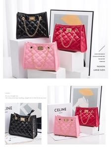 Close-up of quilted bucket bags in charcoal, burgundy, and pink with gold twist-locks