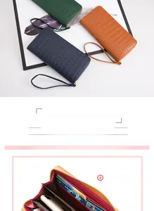 Detailed interior of crocodile pattern wallet showing multi-card slots and wrist strap