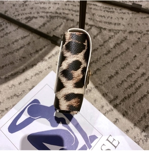 Close-up of leopard print fanny pack showing textured PU leather and side thickness