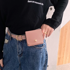 Pink mini waist bag set with fine lychee texture leather and golden metal clasp on denim