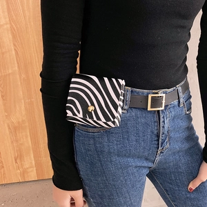 Women's zebra print waist bag with gold buckle belt and textured faux leather finish